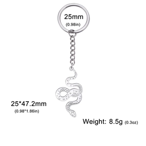 Minimalist stainless steel snake keychain with celestial moon and star pattern engraving