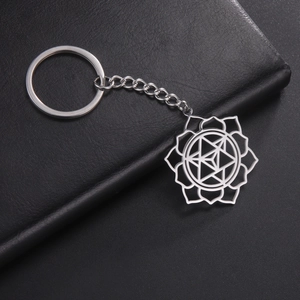 Detailed view of hollow lotus mandala pendant in polished stainless steel finish