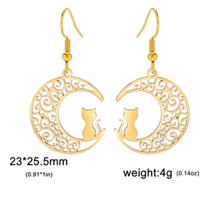 Detail showing golden moon earrings with cat silhouette and hollow scroll patterns