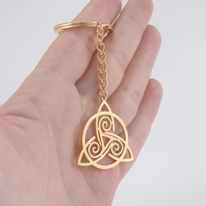 Golden stainless steel keychain featuring a Triskelion Celtic knot pendant and link chain