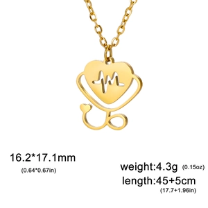 Macro shot of gold-plated heart-shaped stethoscope pendant with EKG wave cutout details