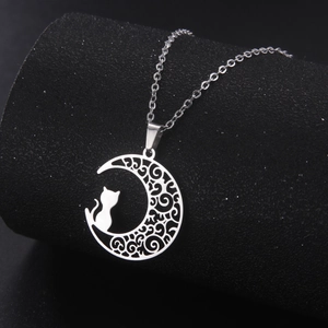 Silver crescent moon and cat silhouette necklace with intricate hollow floral patterns