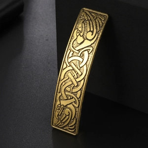 Vintage golden hair clip with intricate Celtic knot and twin bird totem engraving