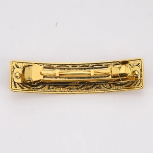Detailed back view of the vintage gold alloy hair clip showing the spring mechanism