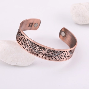 Vintage copper open bangle featuring Celtic tree of life design with therapeutic magnets