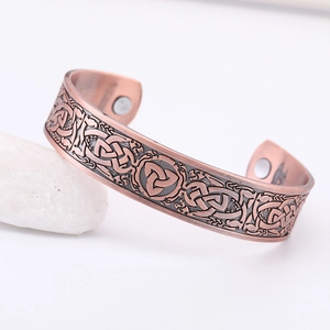 Vintage copper cuff bracelet with Celtic knot texture and healing magnetic therapy stones