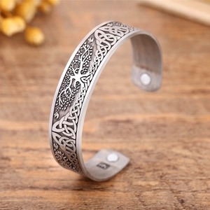 Close-up of vintage Tree of Life bangle with Celtic knot texture and healing magnets
