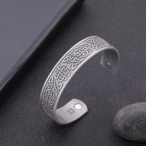 Detail of vintage cuff bracelet with Celtic knots and embedded therapeutic magnets