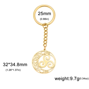 Detail of golden stainless steel keychain with Celtic Triskelion knot pendant and chain