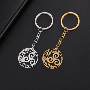 Detail of silver and gold stainless steel keychain with hollow Celtic Triskelion knot
