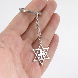 Handheld view of a hollow hexagram and cross pendant stainless steel keychain