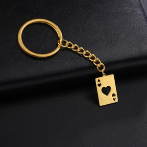 Detailed macro view of a golden stainless steel Ace of Hearts playing card keychain pendant