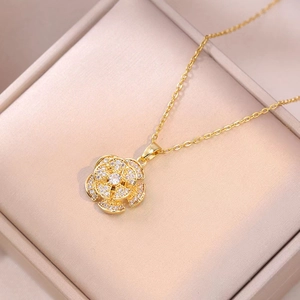 Elegant gold flower necklace with rotating zircon petals and stainless steel chain