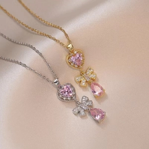 Gold and silver stainless steel necklaces with pink heart, bow, and water drop pendants