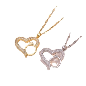 Minimalistische goldene und silberne Herzketten mit glitzernden Zirkonia-Steinen