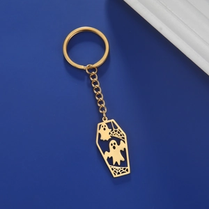 Golden coffin keychain featuring cartoon ghosts and spider webs for Halloween style