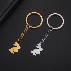 Detailed view of cute rabbit-shaped stainless steel keychains in gold and silver finish