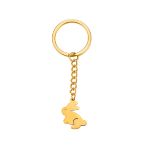 Polished gold stainless steel keychain with a playful rabbit pendant on a white background