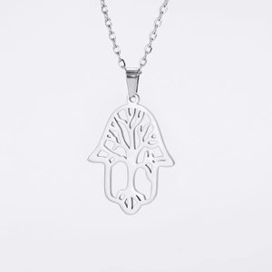 Detailed view of silver Hamsa hand pendant featuring intricate Tree of Life cutout design