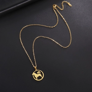 Detailed close-up of a golden standing dog silhouette pendant on a delicate chain