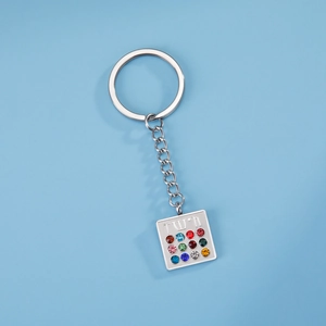 Macro shot of silver stainless steel Hoshen keychain with twelve colorful birthstones