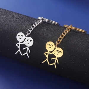 Porte-clés duo en or et argent avec figurines minimalistes et finition polie miroir