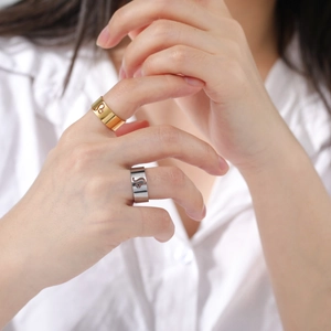 Detailed view of the wide cutout Leo zodiac sign ring in gold and silver finish