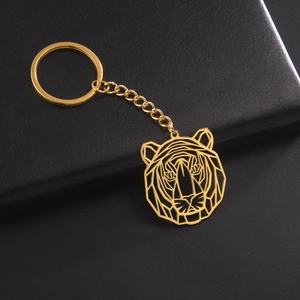 Macro shot of gold geometric tiger head keychain with stainless steel link chain