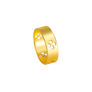 Gold stainless steel wide band ring featuring intricate hollowed clover patterns on white