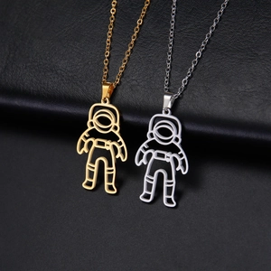 Detail of two-piece astronaut pendant necklaces in gold and silver steel on black leather