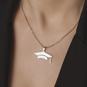 Polished stainless steel graduation cap pendant necklace for men and women on a person