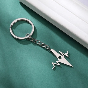Polished stainless steel keychain featuring a heartbeat EKG pendant with cutout heart detail