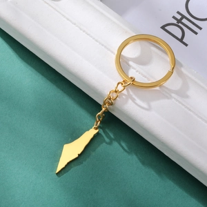 Polished gold map pendant keychain with solid metal chain and geometric landscape charm