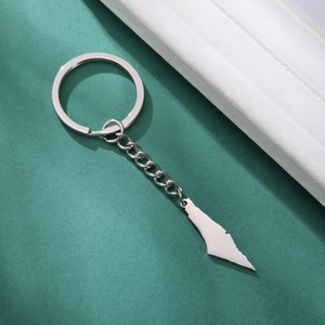 Macro detail of polished stainless steel Israel map pendant keychain with chain link