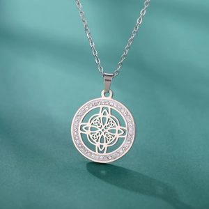 Close-up of silver steel Wiccan knot necklace with sparkling rhinestone paved circle
