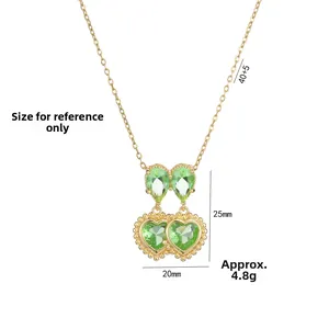 Gold double heart necklace featuring green zircon crystals with dimensions 25mm by 20mm