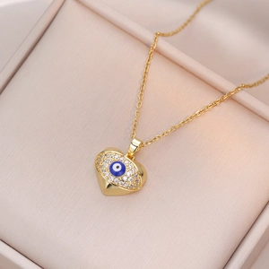Collier cœur doré avec pendentif œil bleu et cristaux de zircone cubique micro-pave