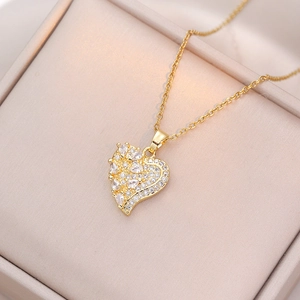 Golden heart necklace with micro-paved zircons and asymmetric drop stones on fine chain