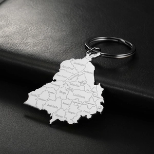 Macro detail of Punjab map pendant on stainless steel keychain with laser-engraved districts