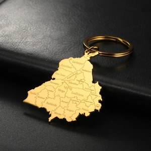 Close-up of golden stainless steel Punjab map keychain with engraved district names