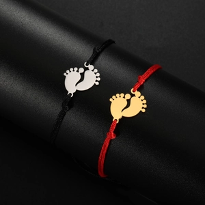 Minimalist stainless steel rope bracelets featuring gold and silver baby footprint pendants