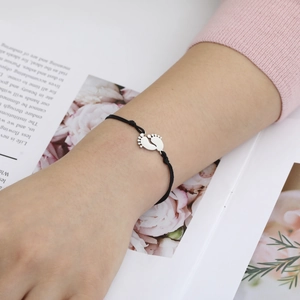 Adjustable black rope bracelet with twin baby footprint charms in polished steel
