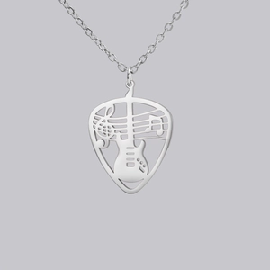 Close-up of guitar pick pendant with musical notes and guitar cutout on silver chain