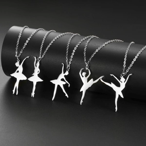 Five silver stainless steel ballet dancer silhouette pendants on sleek display stand