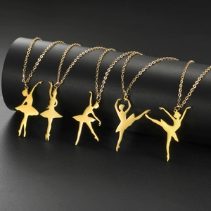 Detailed set of five gold-toned ballet dancer pendants on sleek black display stands