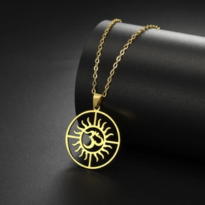 Detailed view of golden Om sun pendant necklace on a premium black display stand