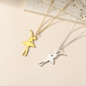 Detail view of elegant ballet dancer pendants in gold and silver stainless steel