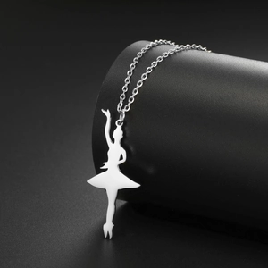 Close-up of a silver ballet dancer pendant necklace with a polished steel finish