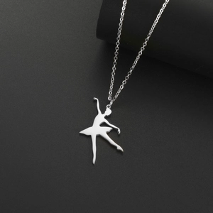Detailed close-up of a silver ballet dancer pendant on an O-chain over a black surface