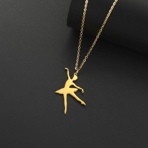Detail of a golden ballet dancer silhouette pendant on a delicate stainless steel chain
